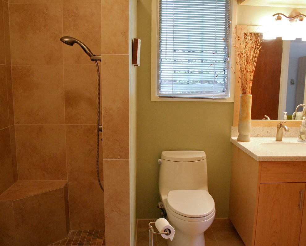 Transitional bathroom in Hawaii with flat-panel cabinets, a curbless shower, ceramic floors, light wood cabinets, beige tile, ceramic tile and an undermount sink.
