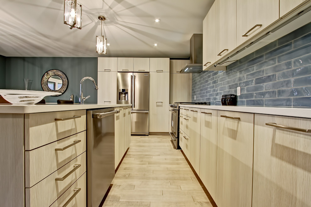 Eat-in kitchen - mid-sized transitional l-shaped light wood floor eat-in kitchen idea in Toronto with a double-bowl sink, flat-panel cabinets, light wood cabinets, quartz countertops, green backsplash, glass tile backsplash, stainless steel appliances and an island