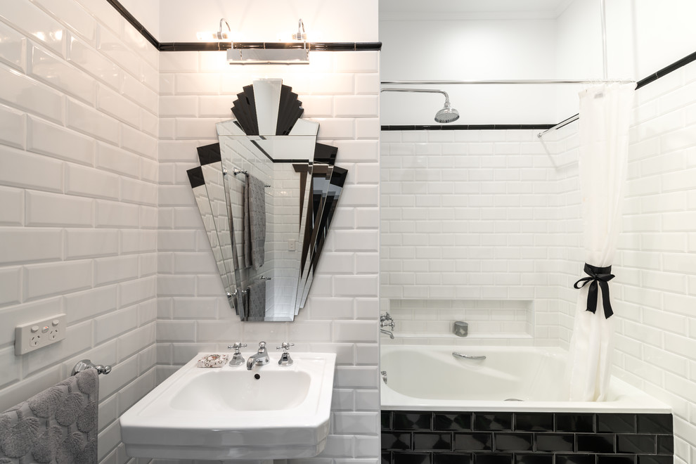 This is an example of a small contemporary master bathroom in Other with a pedestal sink, a drop-in tub, a shower/bathtub combo, a two-piece toilet, white tile, subway tile and white walls.