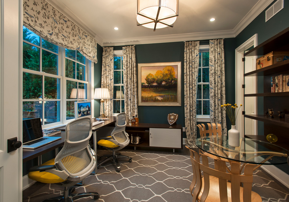 Inspiration for a large timeless freestanding desk dark wood floor study room remodel in Philadelphia with blue walls