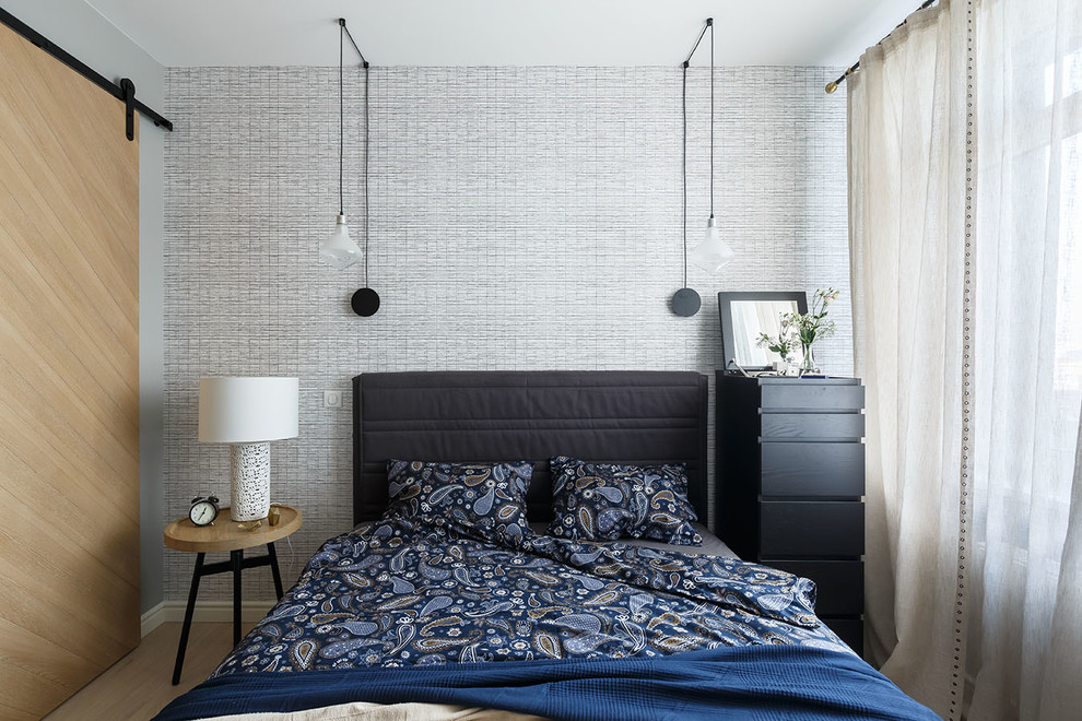 Contemporary master bedroom in Saint Petersburg with grey walls and light hardwood floors.