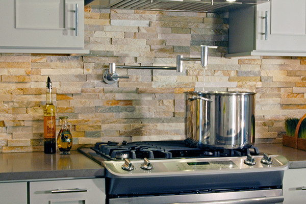 Inspiration for a transitional kitchen remodel in Chicago with shaker cabinets, gray cabinets, zinc countertops, multicolored backsplash, stone tile backsplash and stainless steel appliances