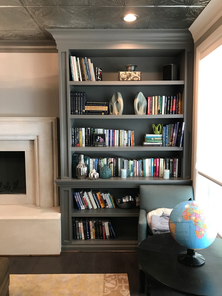 Inspiration for a mid-sized transitional study room in Detroit with a stone fireplace surround, grey walls, ceramic floors, a standard fireplace and brown floor.