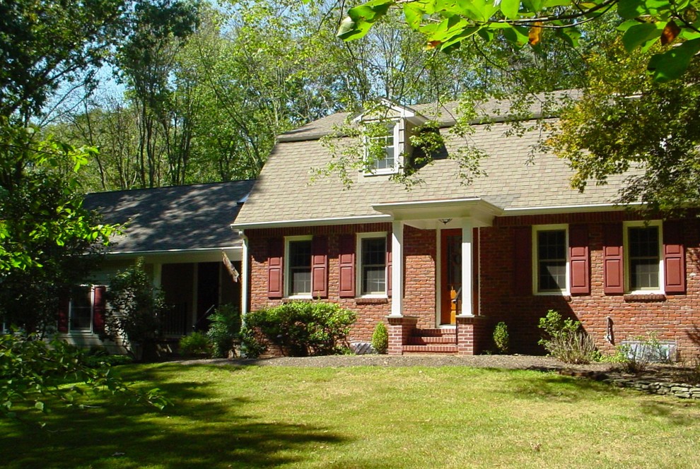 The Gambrel Style exterior is accented with a formal Portico
