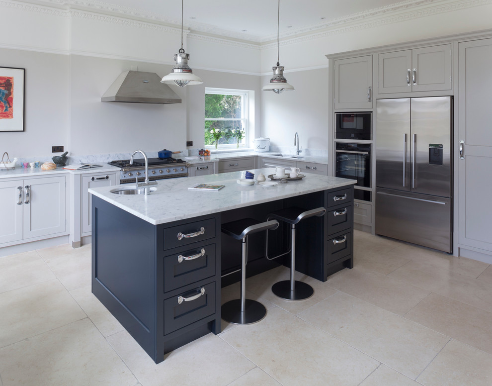 Design ideas for a large traditional l-shaped open plan kitchen in Wiltshire with marble benchtops, stainless steel appliances and with island.