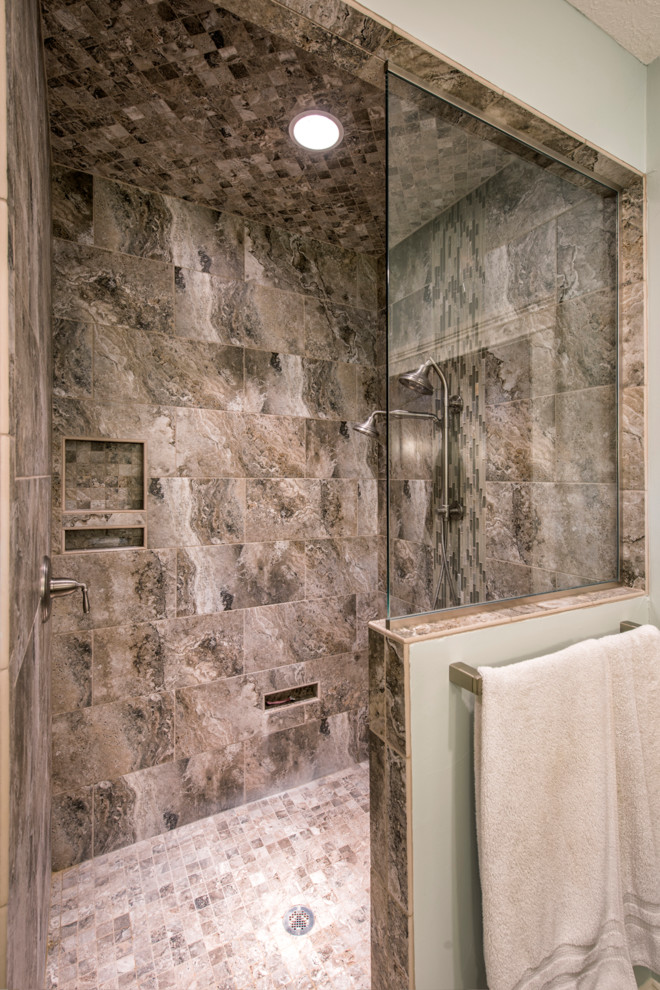 Inspiration for a large transitional master brown tile and porcelain tile porcelain tile and brown floor corner shower remodel with brown walls