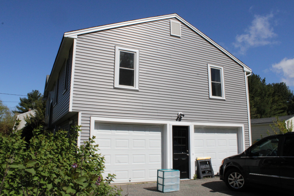 Mid-sized elegant blue vinyl and clapboard house exterior photo in Boston with a shingle roof and a gray roof