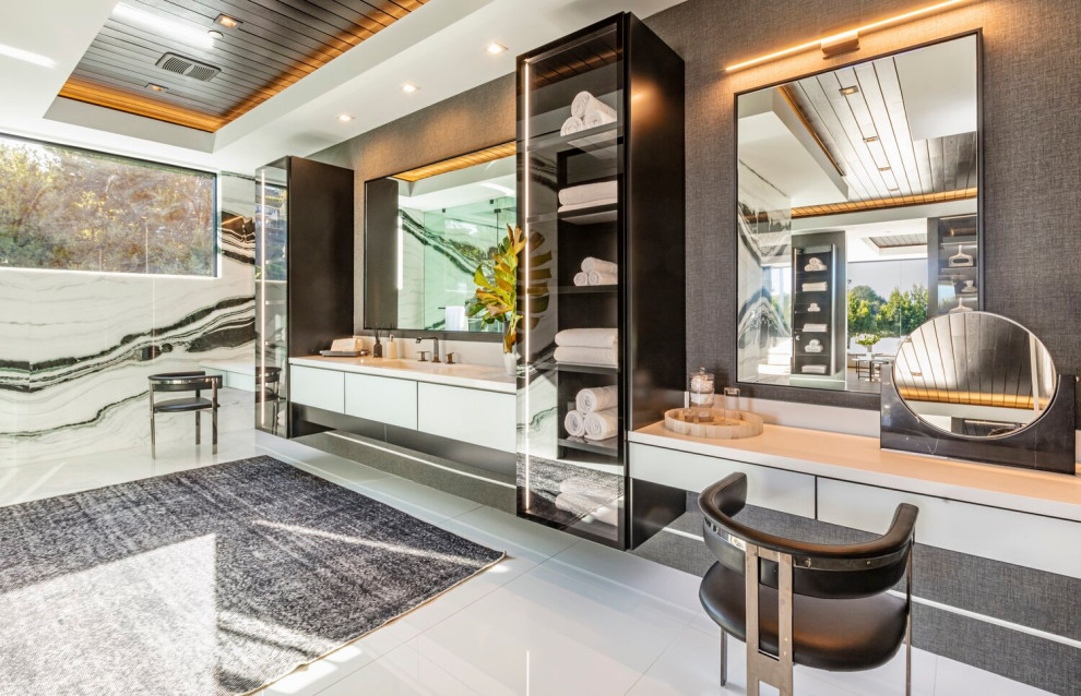 Inspiration for a large modern master bathroom in Los Angeles with black and white tile, marble, multi-coloured walls, white floor, white benchtops, a single vanity and recessed.