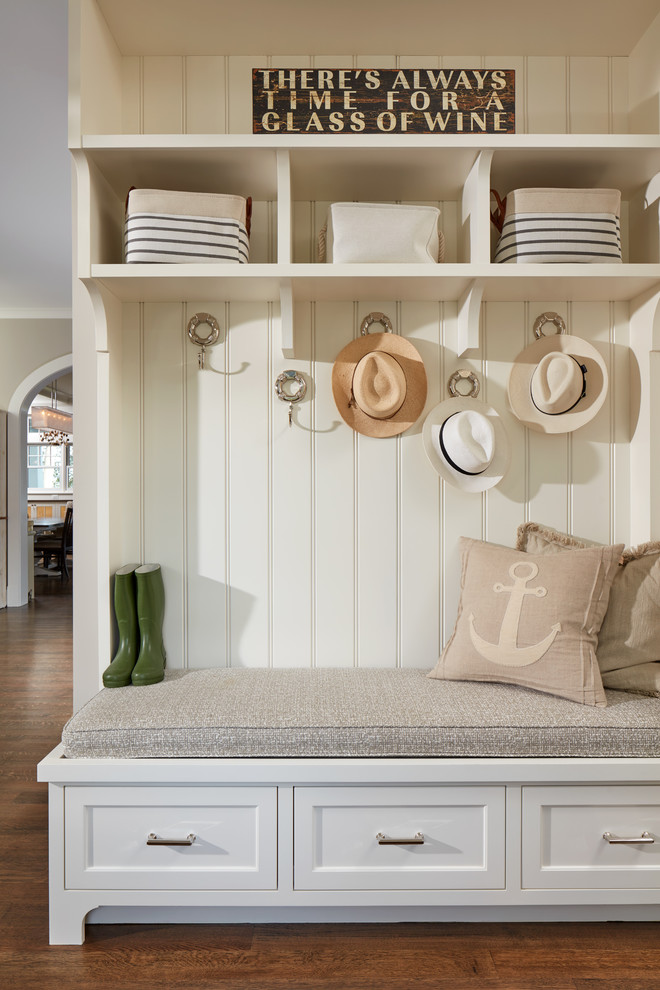Example of a beach style medium tone wood floor mudroom design in Baltimore