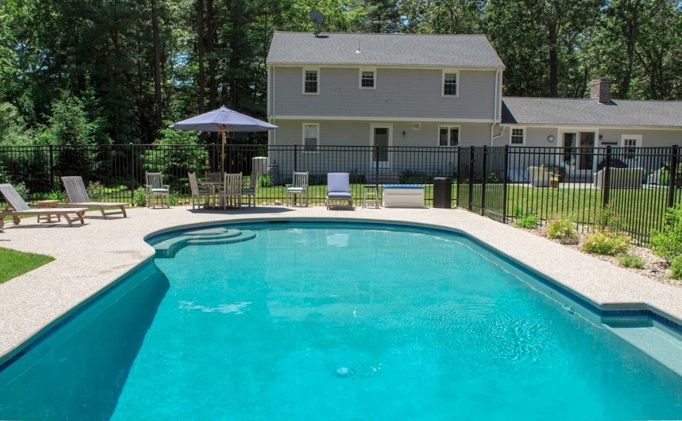 Inspiration for a mid-sized transitional backyard custom-shaped and decomposed granite lap pool house remodel in Boston