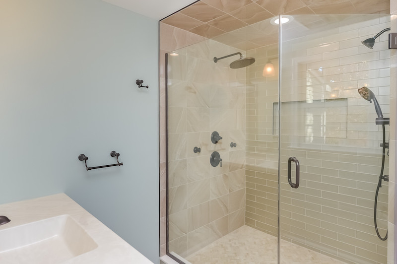 Design ideas for a mid-sized contemporary master bathroom in Philadelphia with a corner shower, a hinged shower door, a single vanity and a built-in vanity.