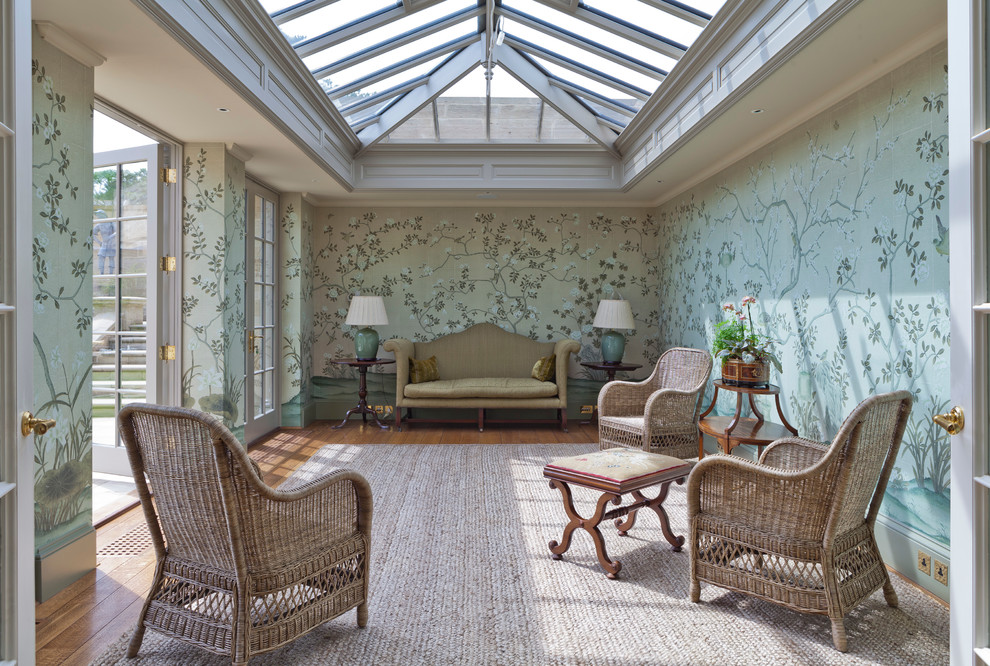 Photo of a large traditional sunroom in Other with medium hardwood floors and a glass ceiling.