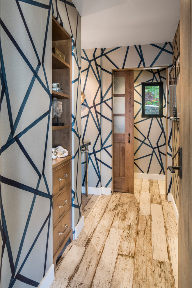 Hallway - mid-sized transitional beige floor hallway idea in Los Angeles with multicolored walls