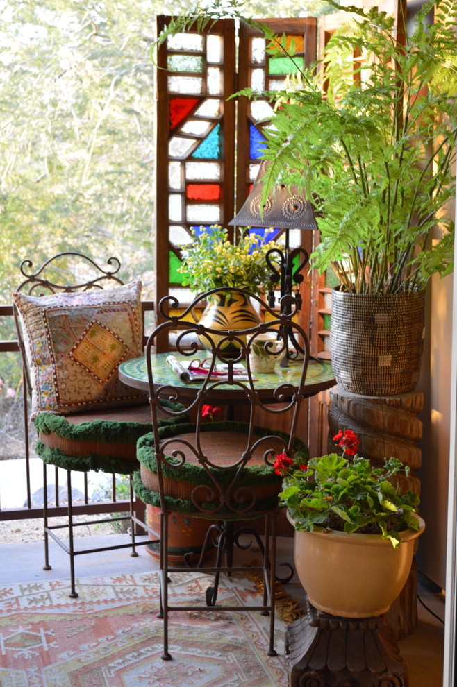 Example of a small eclectic backyard concrete patio design in Phoenix