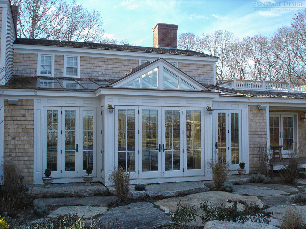Photo of a large traditional sunroom in Boston with slate floors, no fireplace and a glass ceiling.