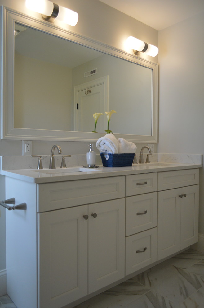 Inspiration for a mid-sized transitional master bathroom remodel in Boston with an undermount sink, quartz countertops, recessed-panel cabinets, white cabinets and white countertops