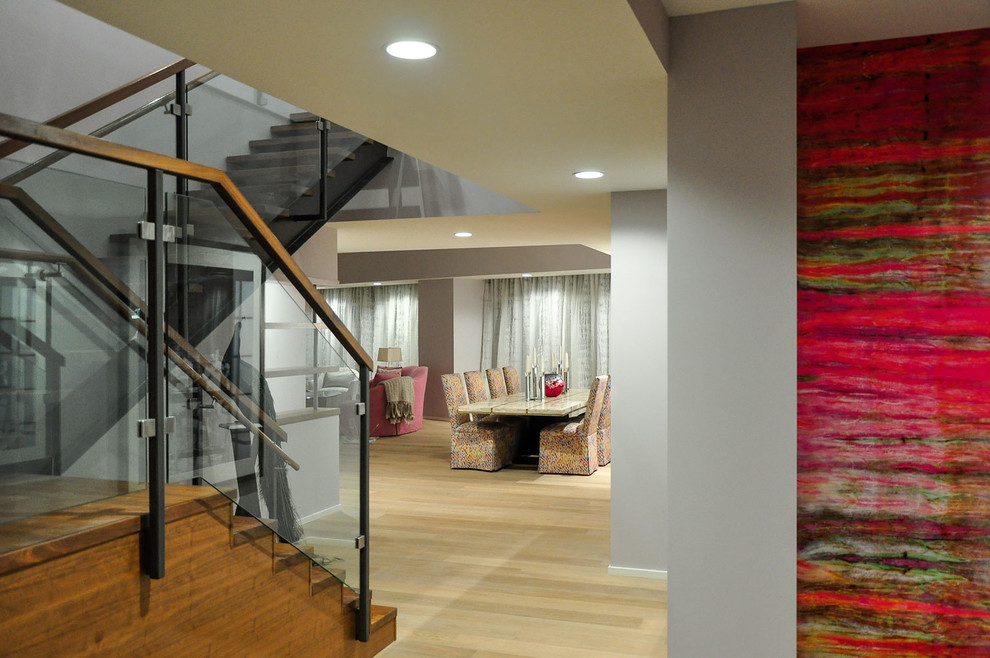 This is an example of a large contemporary wood l-shaped staircase in Los Angeles with wood risers.