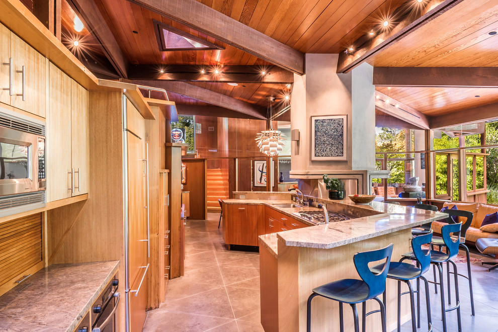 Inspiration for a midcentury open plan kitchen in San Francisco with an undermount sink, flat-panel cabinets, light wood cabinets, panelled appliances and with island.