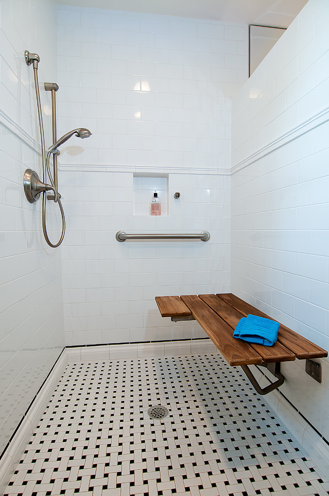 This is an example of a traditional bathroom in Houston with white tile and subway tile.
