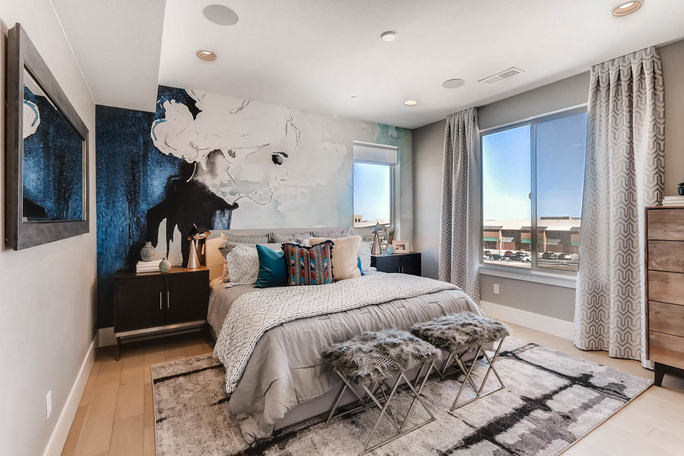 This is an example of a contemporary bedroom in Denver with grey walls, light hardwood floors and beige floor.