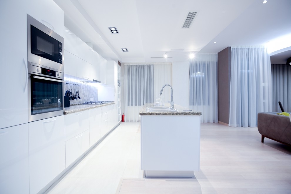 Inspiration for a mid-sized modern single-wall eat-in kitchen in Other with a double-bowl sink, open cabinets, white cabinets, quartzite benchtops, grey splashback, ceramic splashback, coloured appliances, medium hardwood floors and with island.