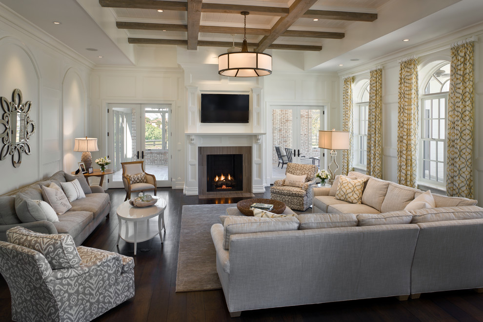Expansive contemporary formal open concept living room in Orlando with white walls, dark hardwood floors, a two-sided fireplace, a tile fireplace surround and a wall-mounted tv.