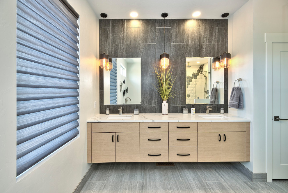 This is an example of a large contemporary master bathroom in Other with flat-panel cabinets, beige cabinets, a freestanding tub, an alcove shower, a two-piece toilet, brown tile, slate, white walls, slate floors, an undermount sink, laminate benchtops, grey floor, a hinged shower door and white benchtops.
