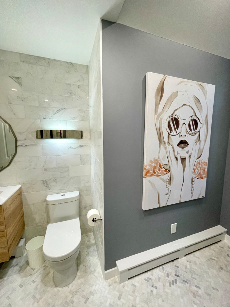 Photo of a contemporary bathroom in New York with ceramic flooring.