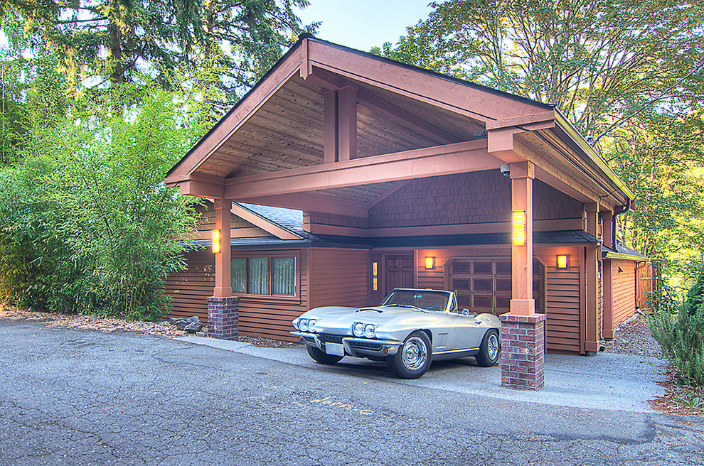 Inspiration for a large arts and crafts attached one-car carport in Seattle.