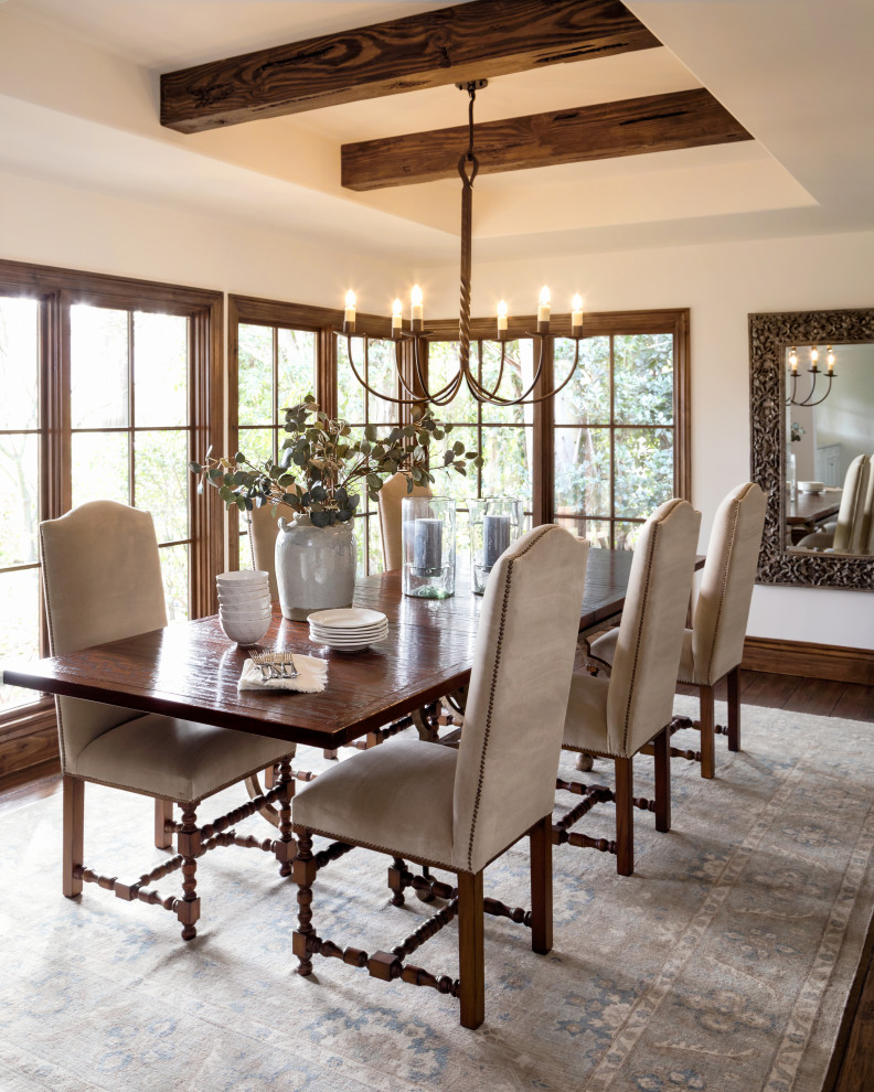 Design ideas for a large mediterranean separate dining room in Los Angeles with white walls, medium hardwood floors, brown floor and exposed beam.