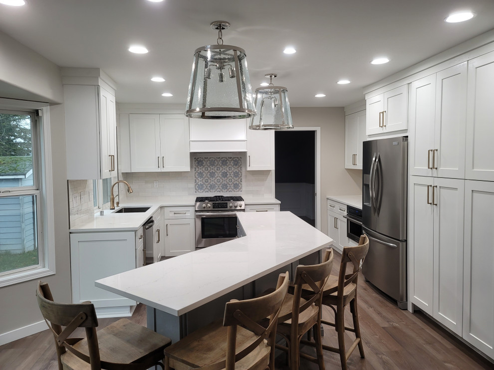Kitchen - mid-sized transitional kitchen idea with recessed-panel cabinets