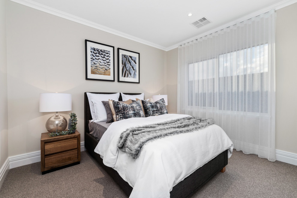 Transitional guest bedroom in Perth with beige walls, carpet, no fireplace and grey floor.