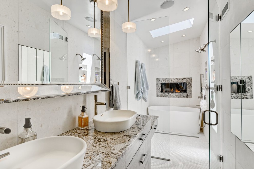 Mid-sized transitional master bathroom in Denver with a vessel sink, flat-panel cabinets, grey cabinets, granite benchtops, a freestanding tub, an open shower, a two-piece toilet, white tile, white walls and mosaic tile floors.