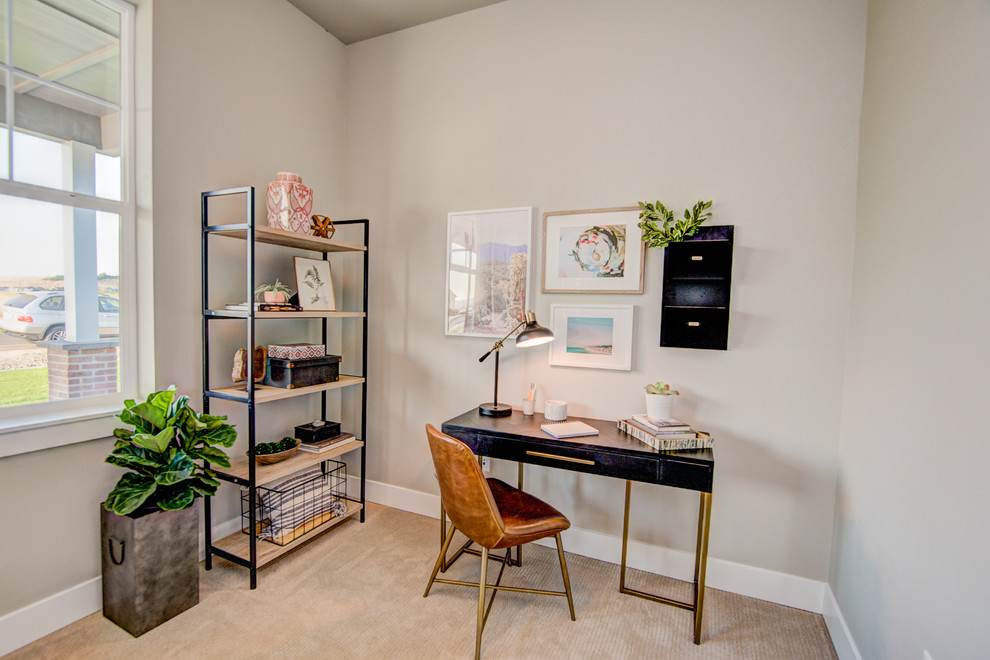 Inspiration for a mid-sized midcentury study room in Seattle with carpet, a freestanding desk and grey floor.