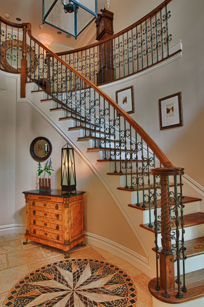 Inspiration for a mid-sized traditional wood curved staircase in New York with painted wood risers.