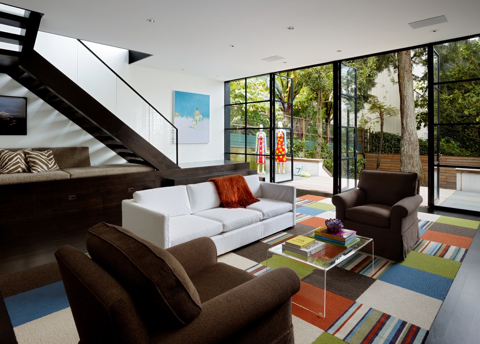Design ideas for a contemporary open concept living room in San Francisco with white walls and dark hardwood floors.
