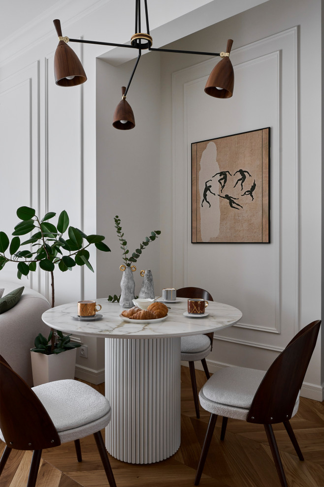 Inspiration for a mid-sized transitional open plan dining in Moscow with white walls, medium hardwood floors and beige floor.