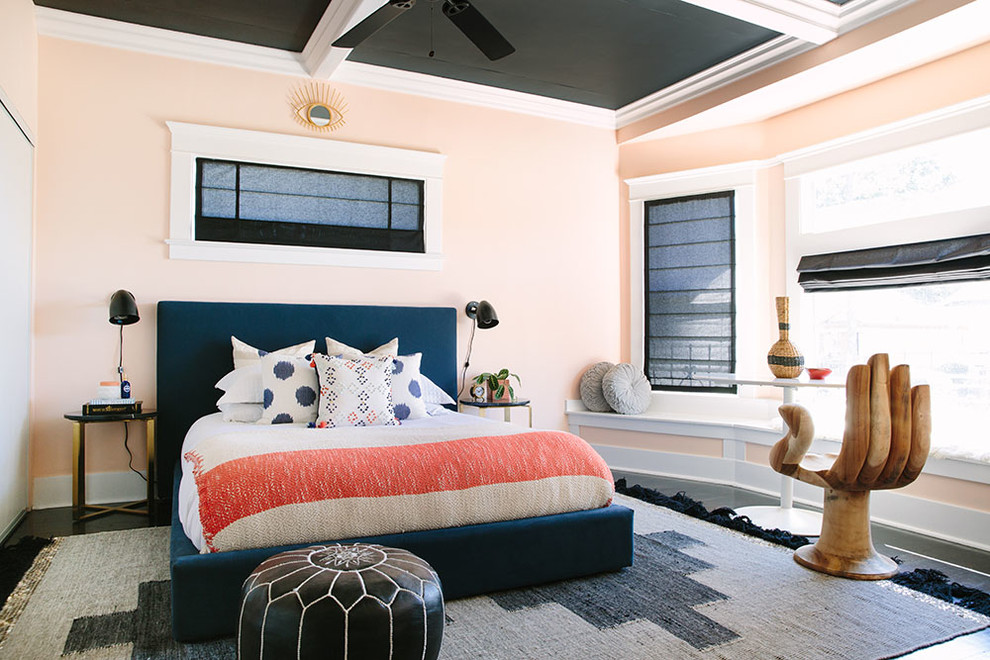 Design ideas for an eclectic bedroom in Los Angeles with pink walls.