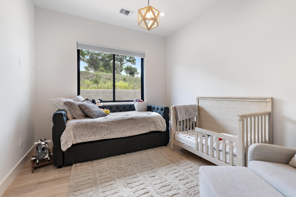 Inspiration for a transitional nursery remodel in Austin