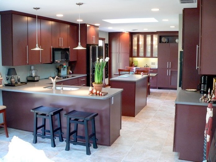 Photo of an asian eat-in kitchen in Other with a double-bowl sink, flat-panel cabinets, dark wood cabinets, solid surface benchtops, ceramic floors and with island.