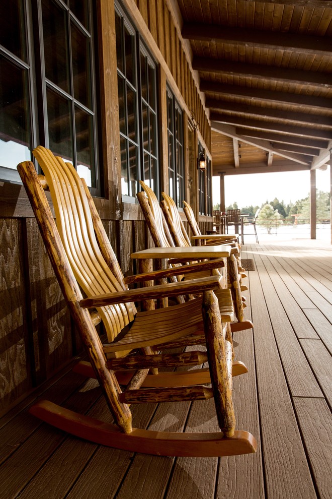 Mid-sized mountain style front porch photo in Phoenix with decking and a roof extension