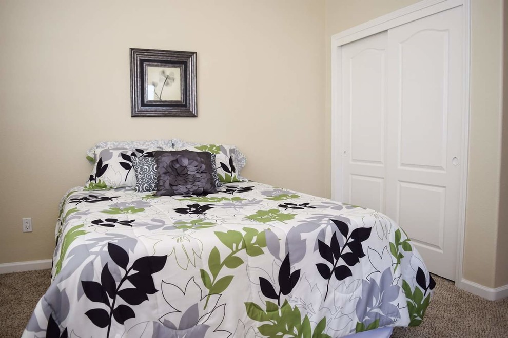 Example of a mid-sized classic carpeted and beige floor bedroom design in Sacramento with beige walls and no fireplace