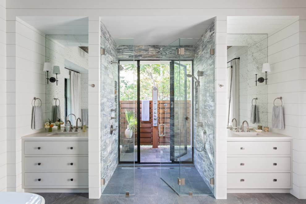 Inspiration for a transitional master wet room bathroom in Charleston with flat-panel cabinets, white cabinets, white walls, an undermount sink, marble benchtops, a hinged shower door, white benchtops, a double vanity, a built-in vanity and planked wall panelling.