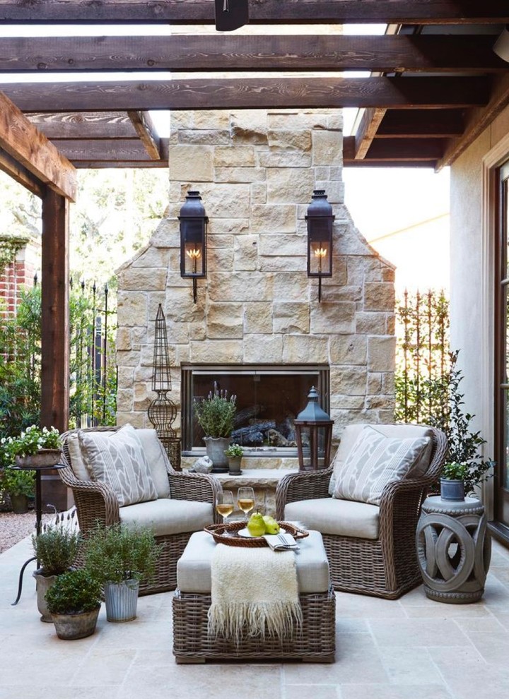 Design ideas for a traditional patio in New York with with fireplace and a pergola.