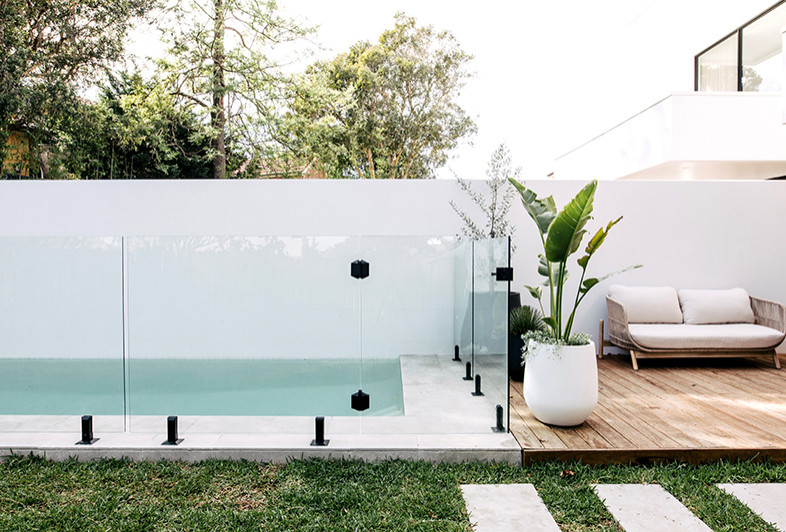 This is an example of a contemporary backyard rectangular pool in Sydney.
