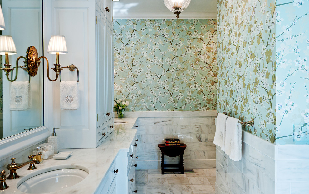 Mid-sized traditional bathroom in Nashville with marble benchtops, an undermount sink, white cabinets, marble floors and multi-coloured walls.