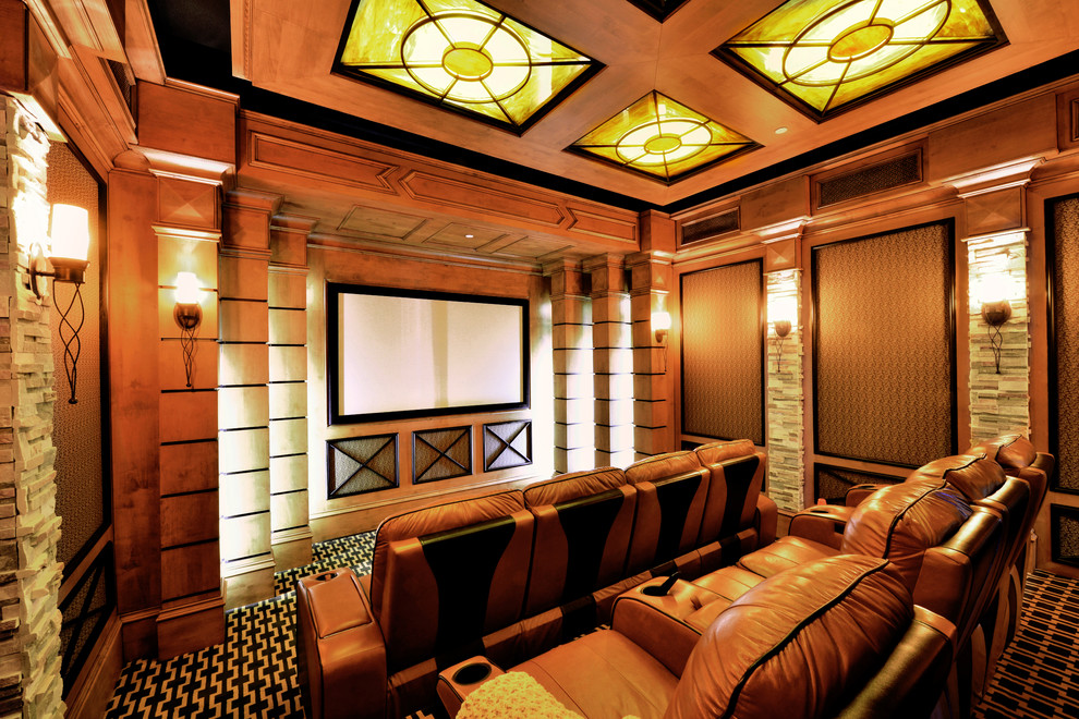 Photo of a large transitional enclosed home theatre in Dallas with brown walls, carpet and a projector screen.