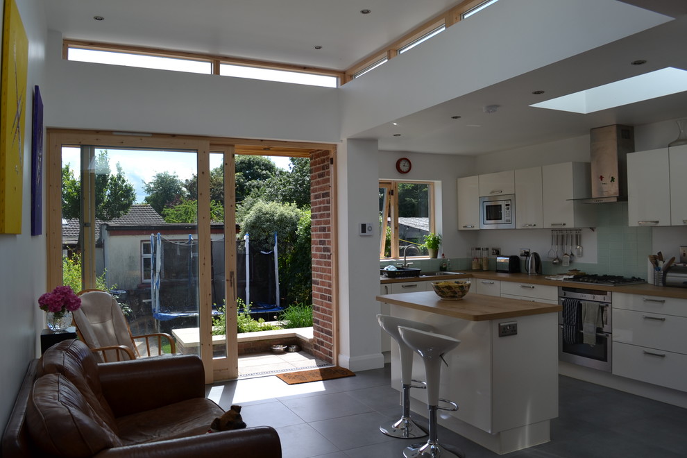 This is an example of a medium sized contemporary kitchen in Dublin.
