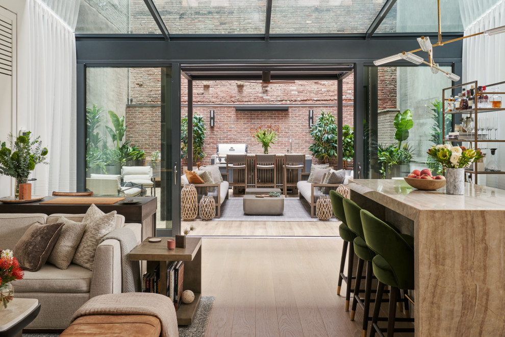 Example of a trendy sunroom design in New York