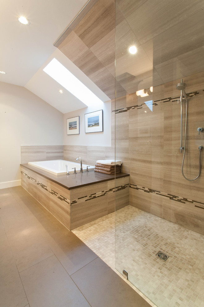 Transitional bathroom in Vancouver with an open shower, a drop-in tub and an open shower.
